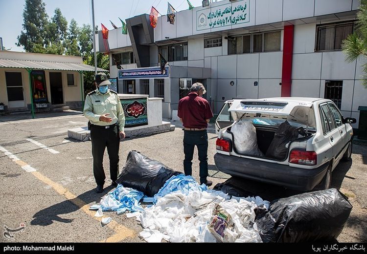 کشف ۱۰۰ هزار ماسک غیربهداشتی در پایانه غرب تهران + تصاویر
